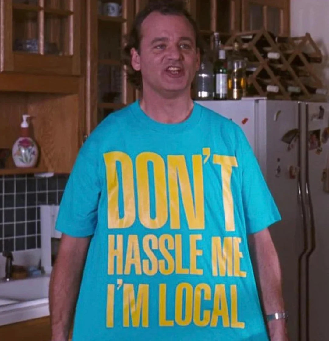 a man wearing a don't hassle me i'm local t -