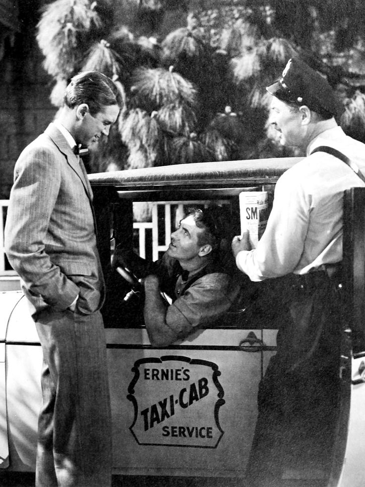 two men in a car talking to each other