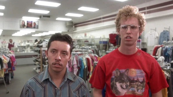 two young men standing in a clothing store