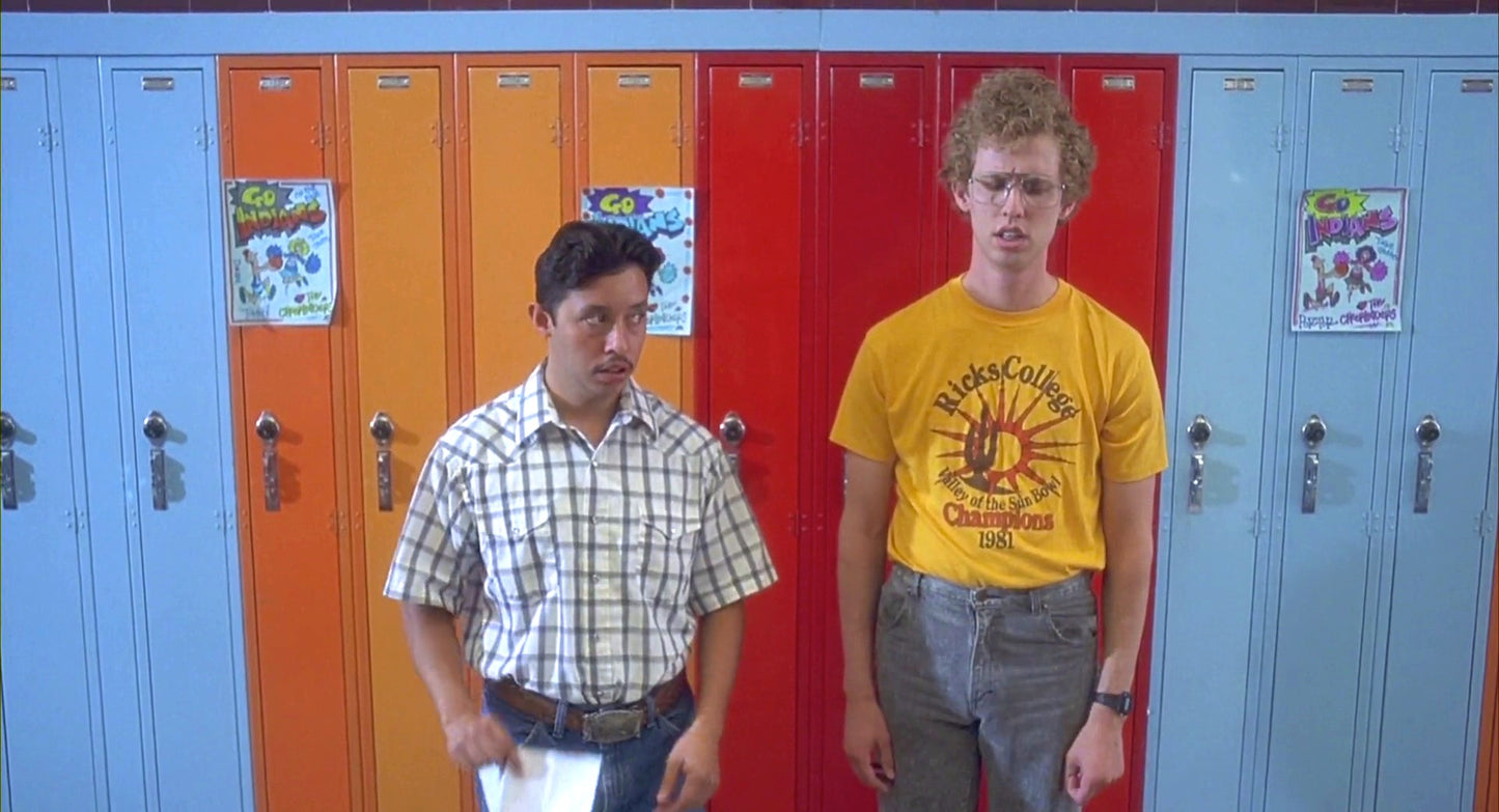 two young men standing in front of lockers