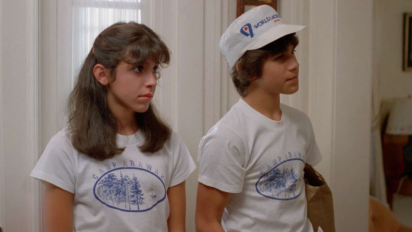 a couple of kids standing next to each other