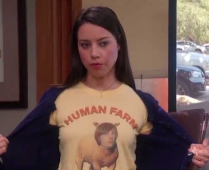 a woman in a yellow shirt with a picture of a sheep on it