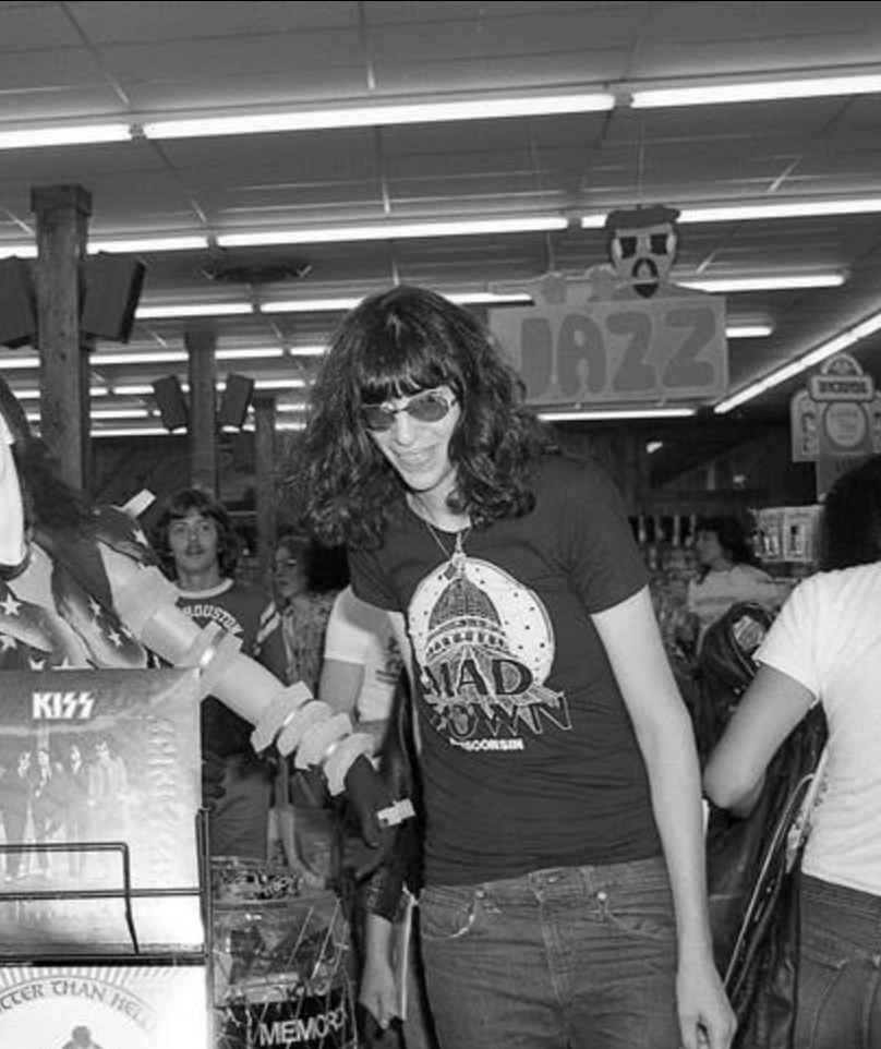 a group of people in a store holding hands