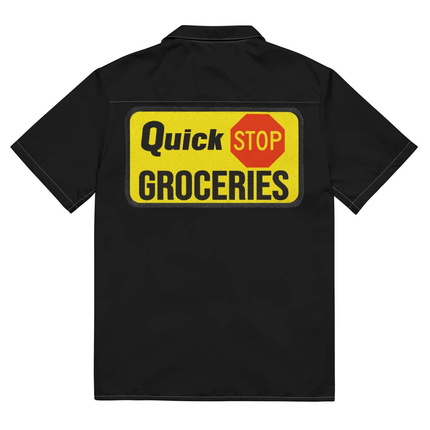Back of black collared short sleeve retro shirt that says "Quick Stop Groceries" with a Stop sign. References the 2022 movie Clerks III.