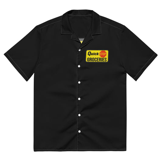 Black button up short sleeve retro shirt with a collar that says "Quick Stop Groceries" on a yellow block with a red stop sign, famously worn by characters Dante Hicks and Randall Grave in the movie Clerks III, written, directed, and produced by Kevin Smith.