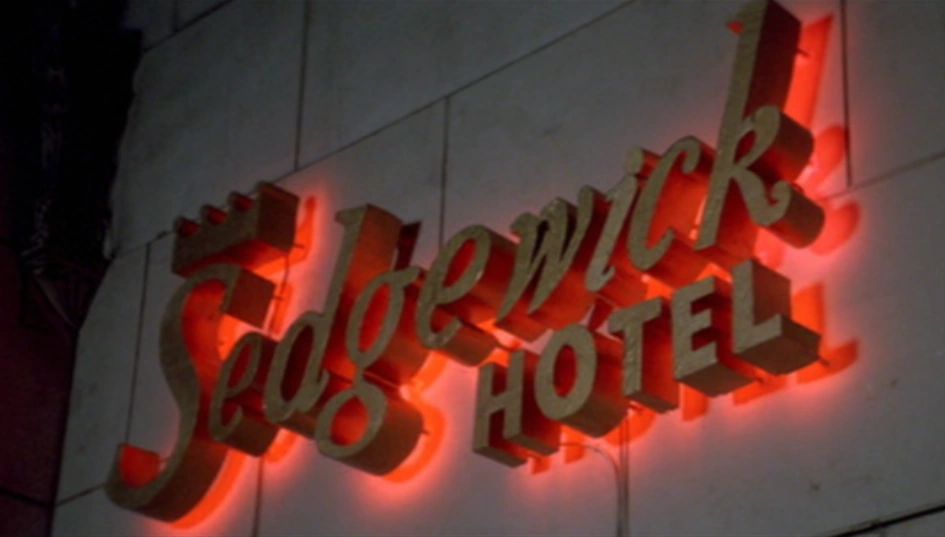 a neon sign on the side of a building