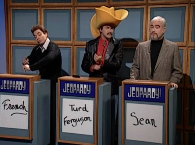 Three men stand behind podiums labeled "French", "Turd Ferguson", and " Sean", each wearing a different colored cowboy hat.