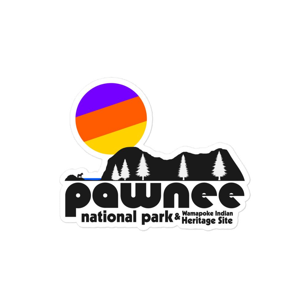 A vintage kiss cut sticker that says Pawnee National Park & Wamapoke Indian Heritage Site under the image of cliffs next to the sea with trees and a small animal with the image of a purple, orange, and yellow sun setting. References the fictional town Pawnee in Indiana from Parks and Recreation (or Parks and Rec), an NBC comedy series.