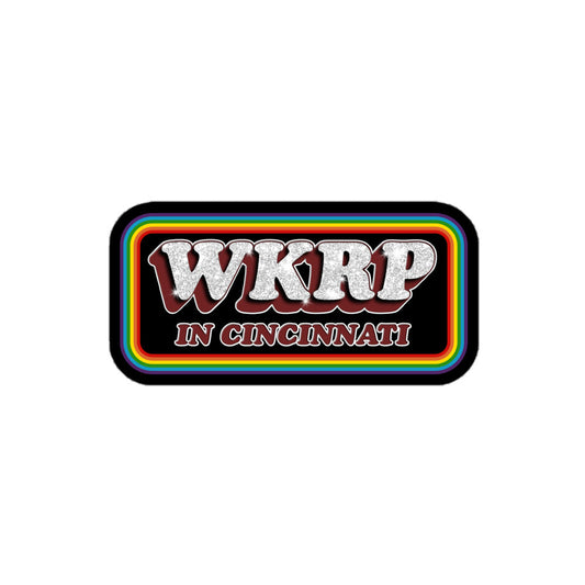A WKRP In Cincinnati rectangular kiss cut sticker with rainbow lines in reference to the sitcom TV show from 1978.