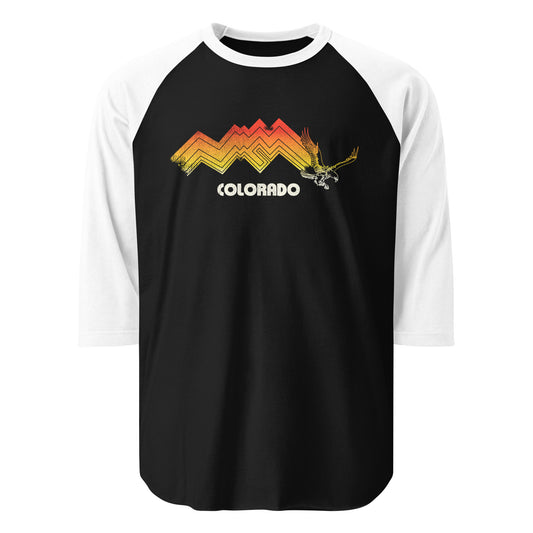 A vintage three quarter sleeve white and black shirt with a red, orange, and yellow Rocky mountain range and yellow eagle and the word Colorado.