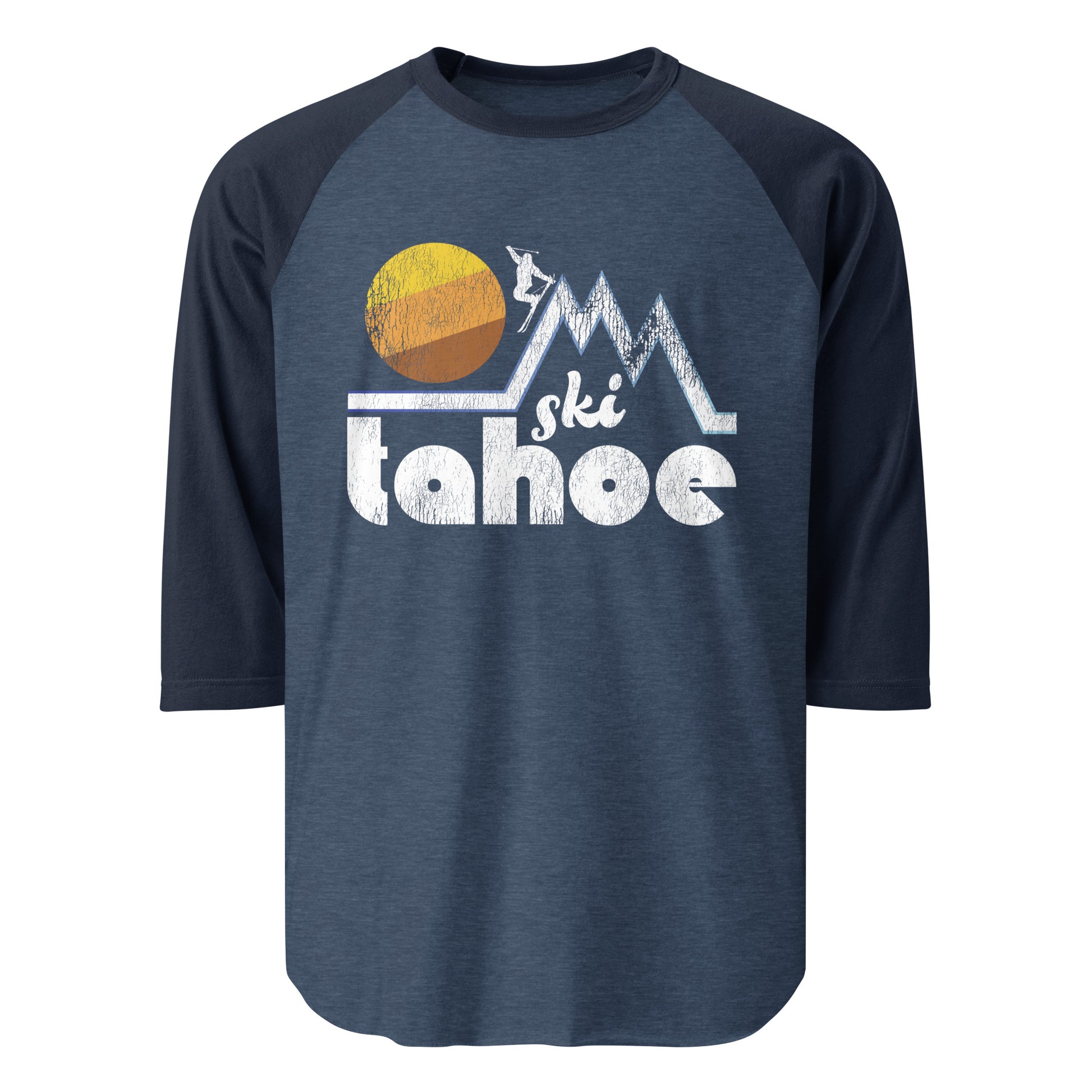 A 3/4 sleeve heather blue and navy raglan shirt that says "Ski Tahoe" (referencing Lake Tahoe) with the image of a person skiing down one of three mountain peaks and a large yellow/orange/brown sun.