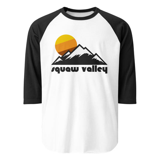 A white and black raglan style "Squaw Valley" 3/4 sleeve shirt. References the area near Lake Tahoe known for its incredible ski resorts and for hosting the 1960s Winter Olympics (now Palisades Tahoe) in California. The shirt includes the image of snowy mountains with triangular peaks and a circular yellow, brown, and orange sun rising in the distance.