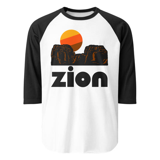 A three quarter sleeved white and black Zion National park shirt with the picture of red rocky landscape and a tricolored sun setting. Zion, located in Utah, is known for its stunning landscape, hiking trails like Angels Landing, slot canyons, and stunning rivers.