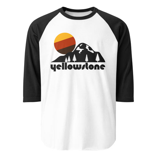 A white and black 3/4 sleeve raglan style retro shirt that says Yellowstone and includes images of a mountain, trees, and a setting yellow, brown, and orange sun. Known as the world's first national park, located in Wyoming, Montana, and Idaho, and is a supervolcano.