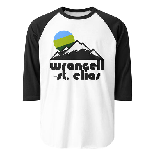 A white and black colored raglan style 3/4 sleeve retro shirt that says "Wrangell-St. Elias" and includes imagery of a mountain range and a setting sun colored in greens and blues. References the national park and preserve in Alaska, the largest in America, including famous volcanoes like Mount St. Elias and glaciers.