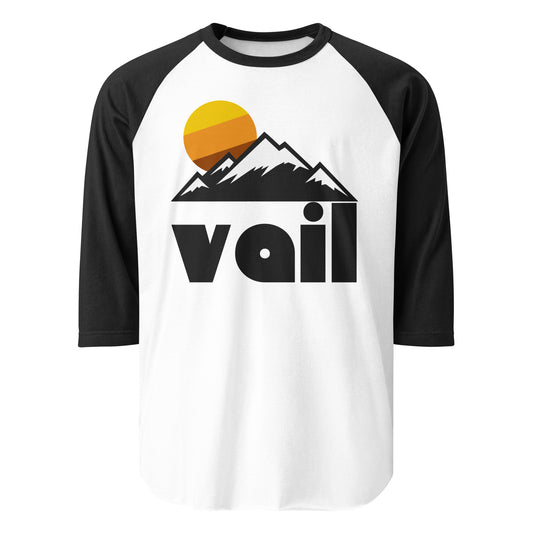 A 3/4 sleeve black and white raglan shirt that says "Vail" under an image of a mountain range and a setting orange/brown/yellow sun. References Vail, Colorado, known for hiking, skiing, snowboarding, and winter sports.