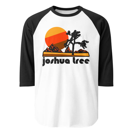 A white and black vintage raglan style three quarter sleeve shirt that says Joshua Tree. Includes the national park's famous trees and red mountains and a beautiful sun.