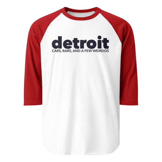 A souvenir three quarter sleeve t-shirt with red sleeves and white body that says "detroit" and "Cars, Bars, and a Few Weirdos" referencing Detroit, Michigan.