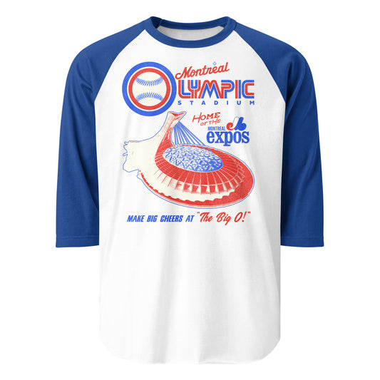 A raglan style retro 3/4 sleeve royal blue and white Montreal Olympic Stadium shirt.  Says "Home of the Expos" in reference to the Canadian MLB team. Says 'Make Big Cheers at "The Big O!", nickname of the baseball stadium. Image of the Olympic Stadium in red, white, and blue, colors of the Expos, and a baseball.