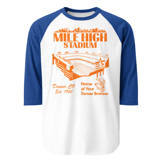 A retro three quarter sleeve raglan style blue and white shirt for the "Mile High Stadium" in "Denver, CO" which was "Est. 1960" and was the "Home of Your Denver Broncos" from 1960-2000. Has an orange mountain range image, and the rectangular stadium with a sign that reads "Mile High Monument". Has image of the Bronco's logo, a football player riding on "Thunder", the Arabian horse team mascot.