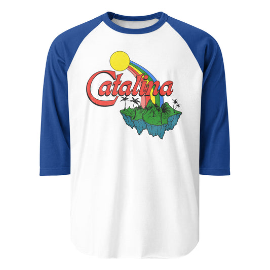 An 80s blue and white vintage raglan style three quarter sleeve shirt with the word "Catalina" and a yellow sun shining a vibrant rainbow down to a forest green palm tree covered island. References Santa Catalina Island, a scuba diving and hiking island near Los Angeles.