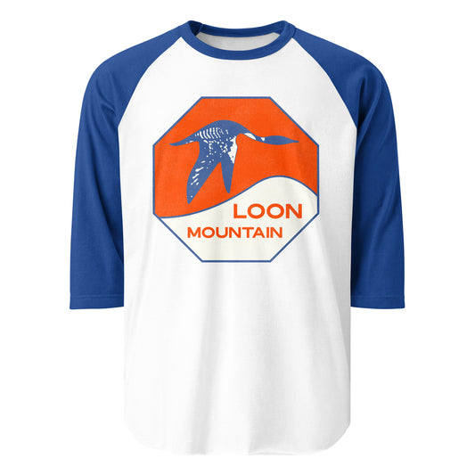 A vintage three quarter sleeve raglan style t-shirt in royal blue and white. Says Loon Mountain, referencing the New Hampshire resort on the White Mountain Range with Loon Peak, North Peak, and South Peak. Image of blue loon against orange sunny backdrop and a snowy skiiing and snowboarding hill.