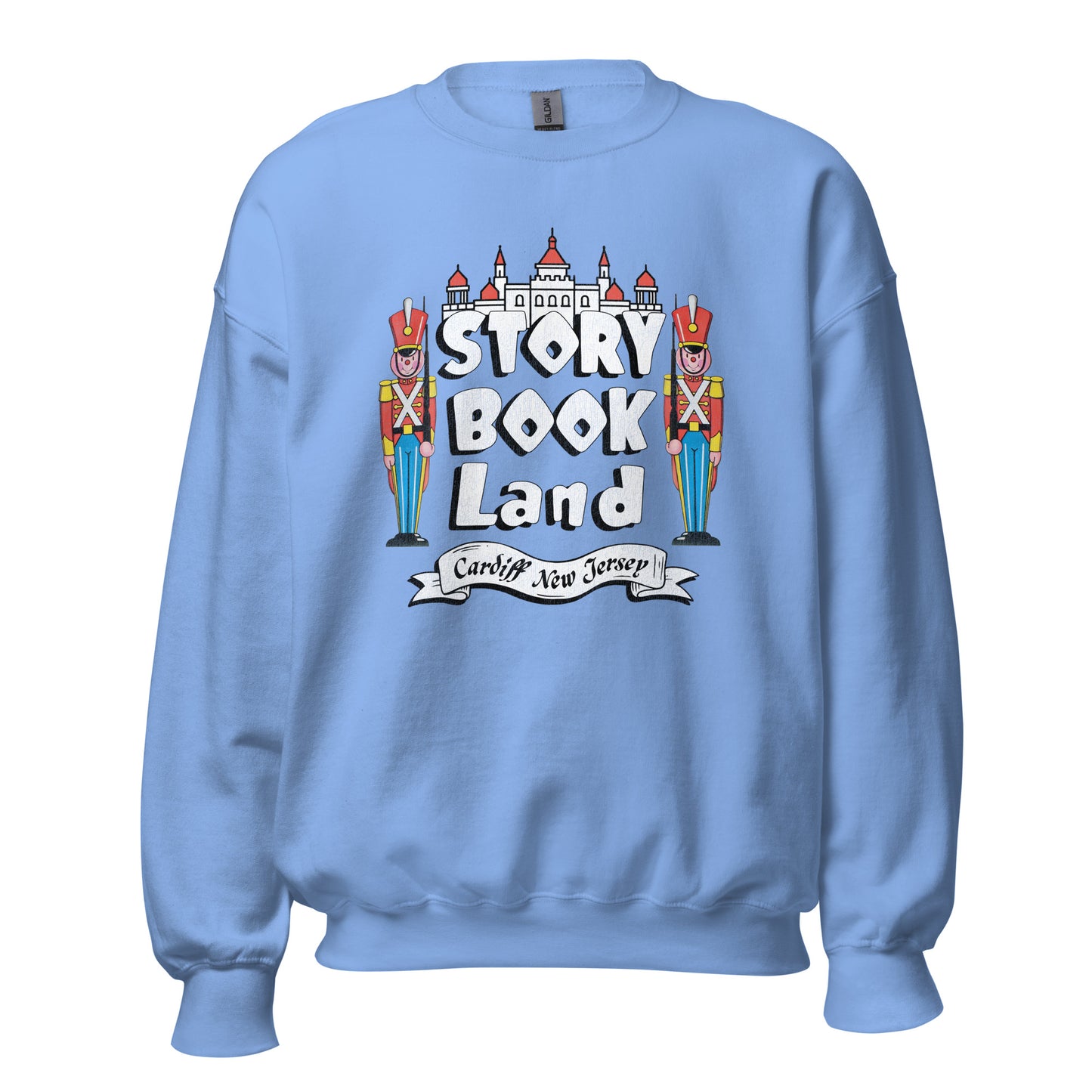 A baby blue retro crew neck sweatshirt with a castle image and two toy soldiers guarding and the words "Story Book Land" and "Cardiff New Jersey" referencing the children's theme park.