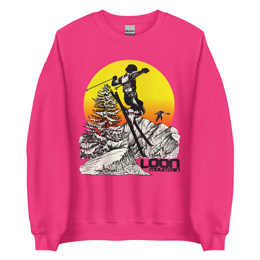 A heliconia colored pink crew neck retro style sweatshirt that says Loon Mountain from Loon Mountain Resort in New England. Image of man skiing by the White Mountains, a loon bird flying, snow colored aspen tree, and a yellow and orange sunrise.