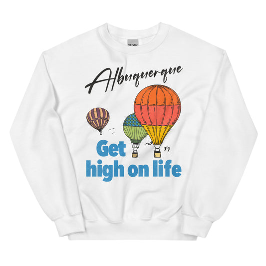 A white retro crew nek sweatshirt with three hot air balloons soaring in the sky. Says Albuquerque and Get high on life referring to the famous tourist destination hot air balloon annual festival in the New Mexico desert.