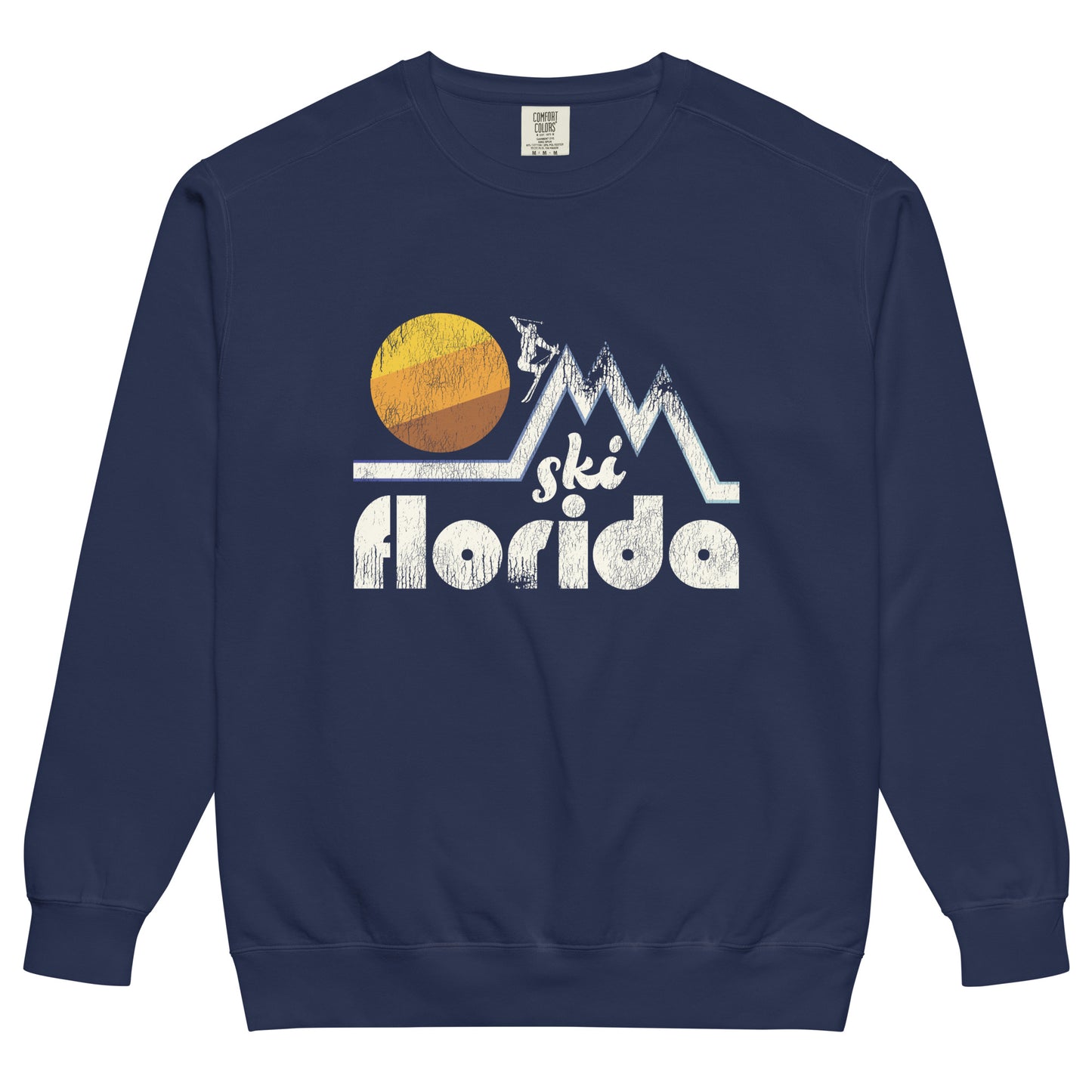 A retro 80s style tourist navy colored crew neck sweatshirt that says "Ski Florida" under the image of a skier on top of a mountain range with a circular sun in the background.