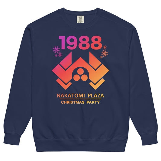 A true navy blue colored vintage tourist sweatshirt that says "Nakatomi Plaza Christmas Party" and the year "1988" in reference to the classic thriller movie 'Die Hard' directed by John McTiernan,  starring Bruce Willis and Alan Rickman. Image on the sweatshirt of snowflakes, as the movie takes place on Christmas Eve, and the Nakatomi Plaza skyscraper logo in hombre purple, red, orange, and yellow colors.