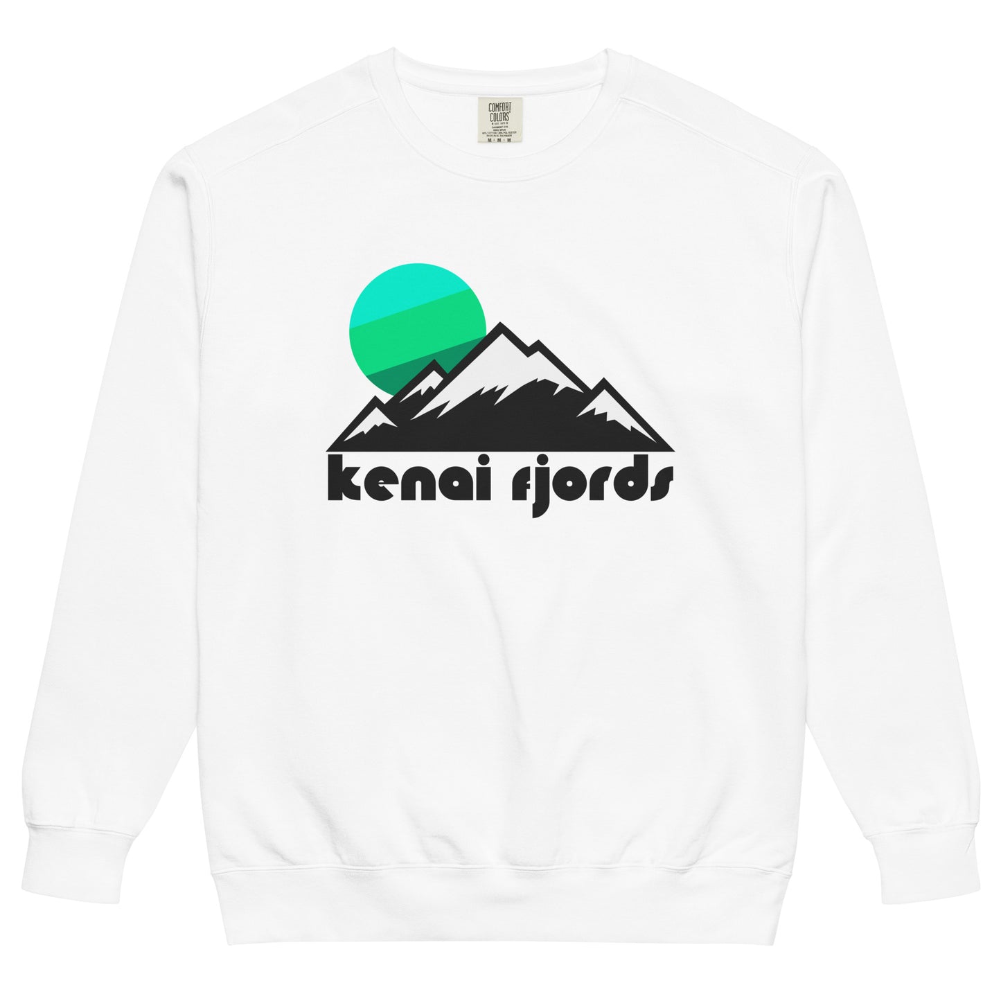 A vintage, 80s style white crew neck sweatshirt that says 'kenai fjords' and includes the image of an icy and snowy mountain range under a cool toned blue and green sun setting. In reference to the glacial wonderland known as Kenai Fjords National Park in Seward, Alaska, famous for its location right on the Pacific Ocean and its many glaciers, reminiscent of the Ice Age.