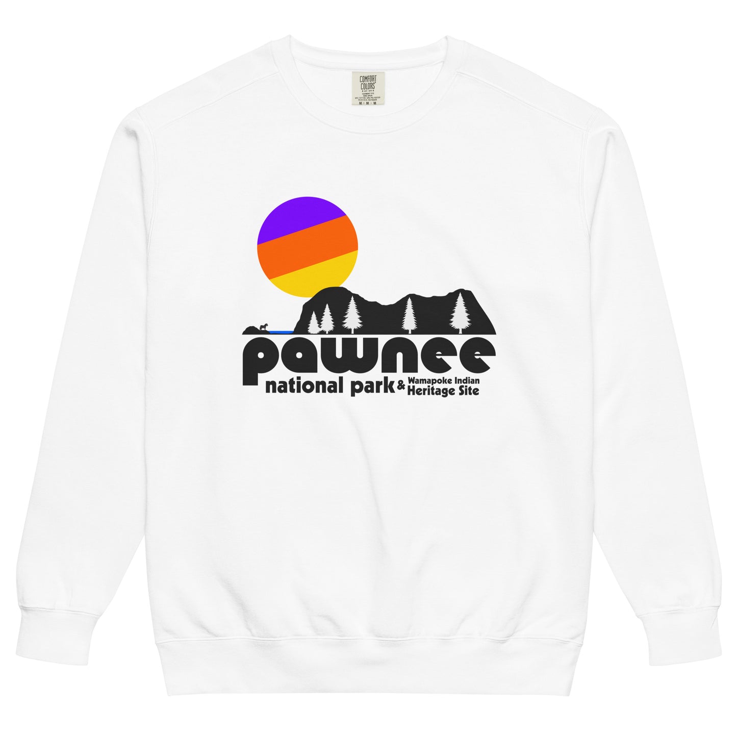 An 80s style, tourist white colored crew neck sweatshirt that says "Pawnee National Park & Wamapoke Indian Heritage Site", referencing the famous NBC sitcom and comedy Parks and Rec which takes place in Pawnee, Indiana. Includes the image of a pretty lake, rocky and cliff, and tree filled area with a small animal standing on an island, as well as a colorful sun setting behind the landscape.