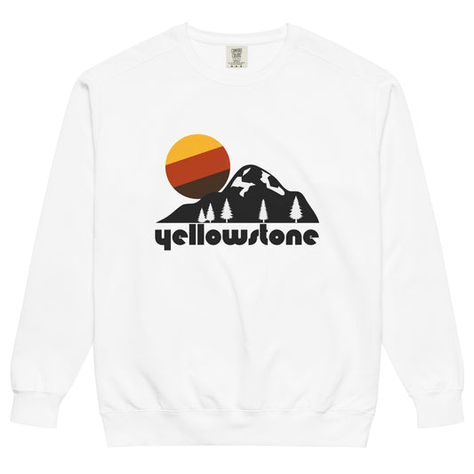 A souvenir vintage Yellowstone white crew neck sweatshirt with the image of a mountain covered in snowfall, a pine tree forest, and a sun colored in yellow, red, and brown stripes. Refers to Yellowstone National Park, also known as Yellowstone Caldera or the Yellowstone Supervolcano, including famous geysers like Old Faithful and mountains like Eagle Peak, Mount Shurz, and Mount Humphreys.