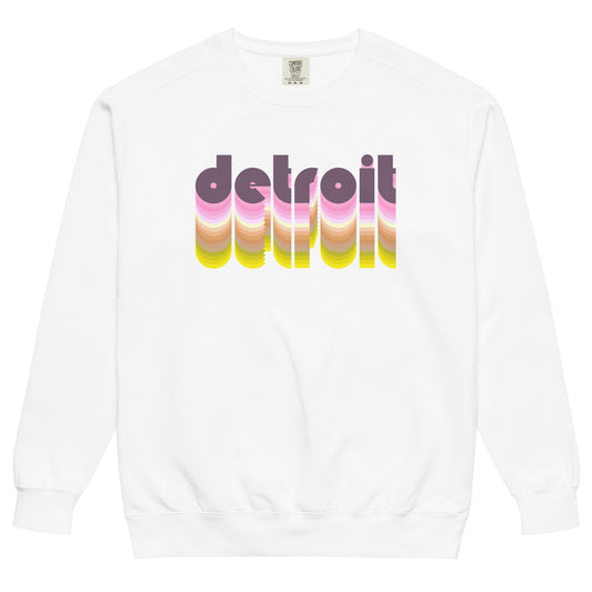 A souvenir tourist white Detroit, Michigan crew neck sweatshirt that has the word 'Detroit' in purple bubble letters. Fades into shades of pink, white, brown, yellow, and green.