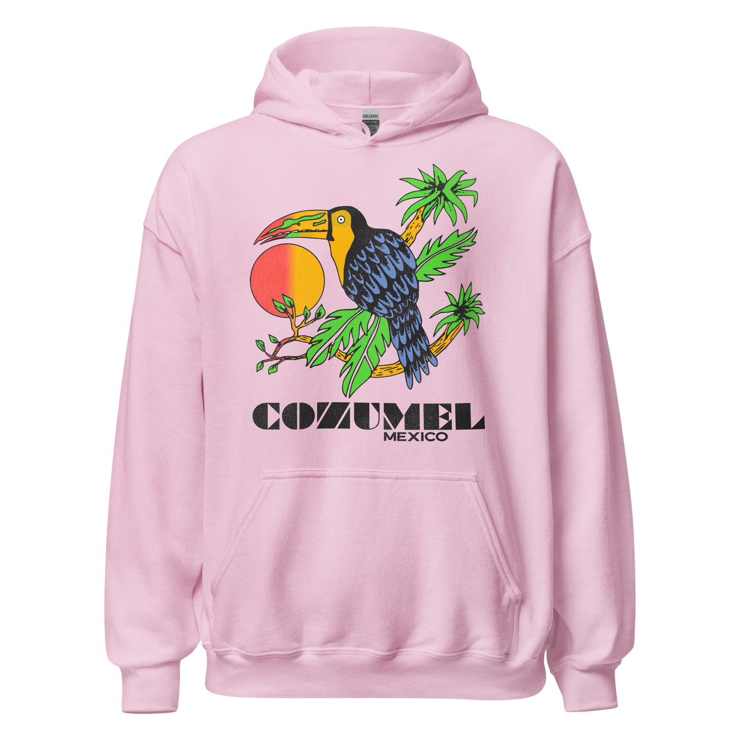 A light pink Cozumel Mexico tourist hooded sweatshirt with a blue black feathered bird with a green, red, and yellow beak sitting on palm trees in front of a red orange sunrise.