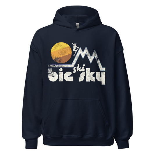 A navy blue souvenir Ski Big Sky hooded sweatshirt - referencing Montana's Big Sky Ski Resort - with a skier skiing down one of three triangle mountain range peaks in front of a striped yellow/orange/brown sun in the sky.
