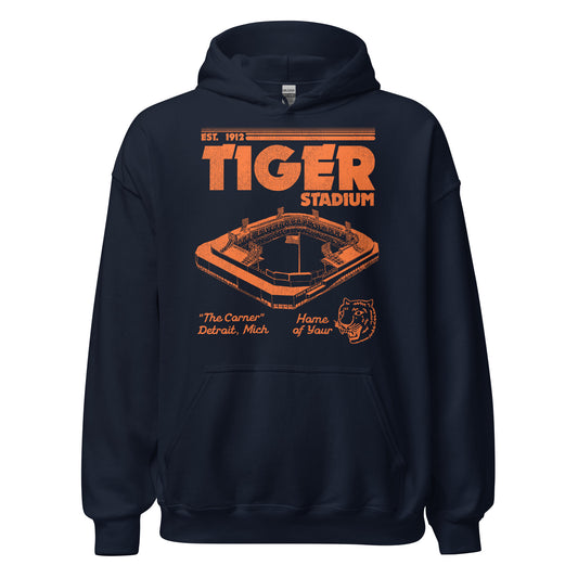 A Tiger Stadium navy blue hoodie sweatshirt for travel. The stadium was established in 1912 on "The Corner" of Michigan and Trumbull in Detroit, Michigan. Known as the "Home of Your Tigers", the Detroit professional baseball team until 2000. Image of the stadium in orange with a tall flag and a tiger logo of the baseball team.