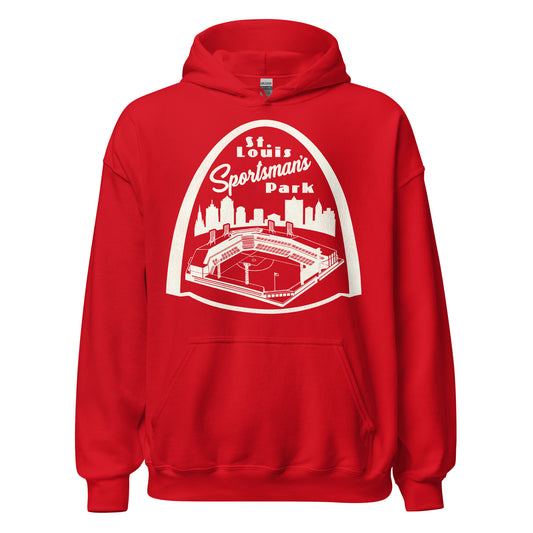 A bright red vintage hoodie sweatshirt that says "St. Louis Sportsman's Park" in reference to the stadium which served multiple MLB, NFL, and soccer teams. Image of the The Arch on top of the skyline of St. Louis, MO and the now defunct baseball stadium.