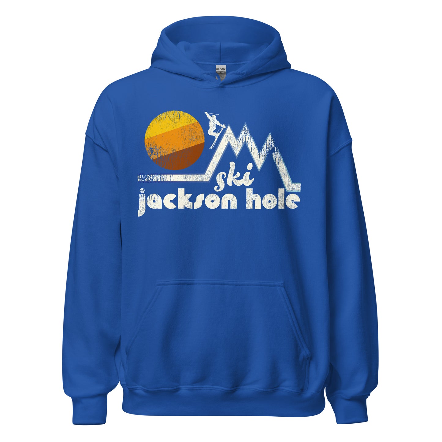 A royal blue retro 80s style "Ski Jackson Hole" hooded sweatshirt. References the Wyoming town known for hiking, skiing, and snowboarding in the stunning Grand Teton Mountain Range. . Image of three white mountain peaks and skier heading down the tallest slope, a striped sun behind.