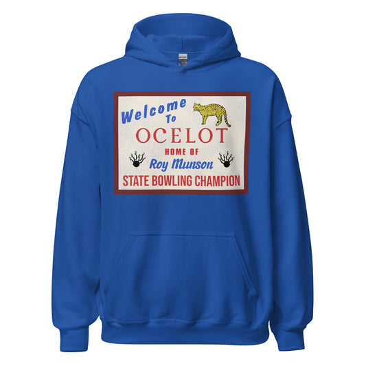 A 90s retro royal blue hoodie sweatshirt with the worlds Welcome to Ocelot with an ocelot leopard cheetah image and "Home of Roy Munson State Bowling Champion" with bowling pins and balls. Refers to 1996 movie Kingpin and Ocelot, Iowa.