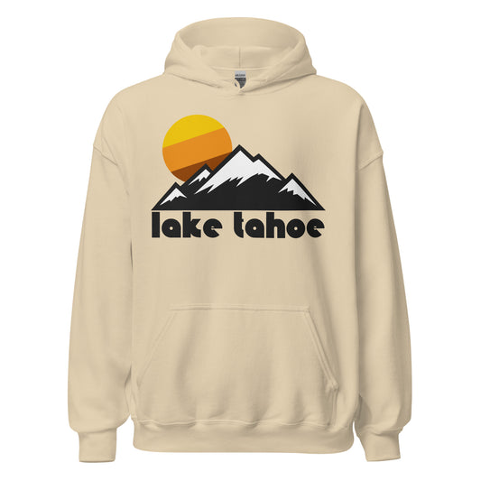 A vintage, souvenir Lake Tahoe sand colored hooded sweatshirt that includes the image of a mountain range with snowy peaks and a tricolored yellow/orange/brown sun. The lake is a popular tourist destination, especially for those who love hiking, skiing, and snowboarding, and has many resorts, camping sites, and tourist attractions.