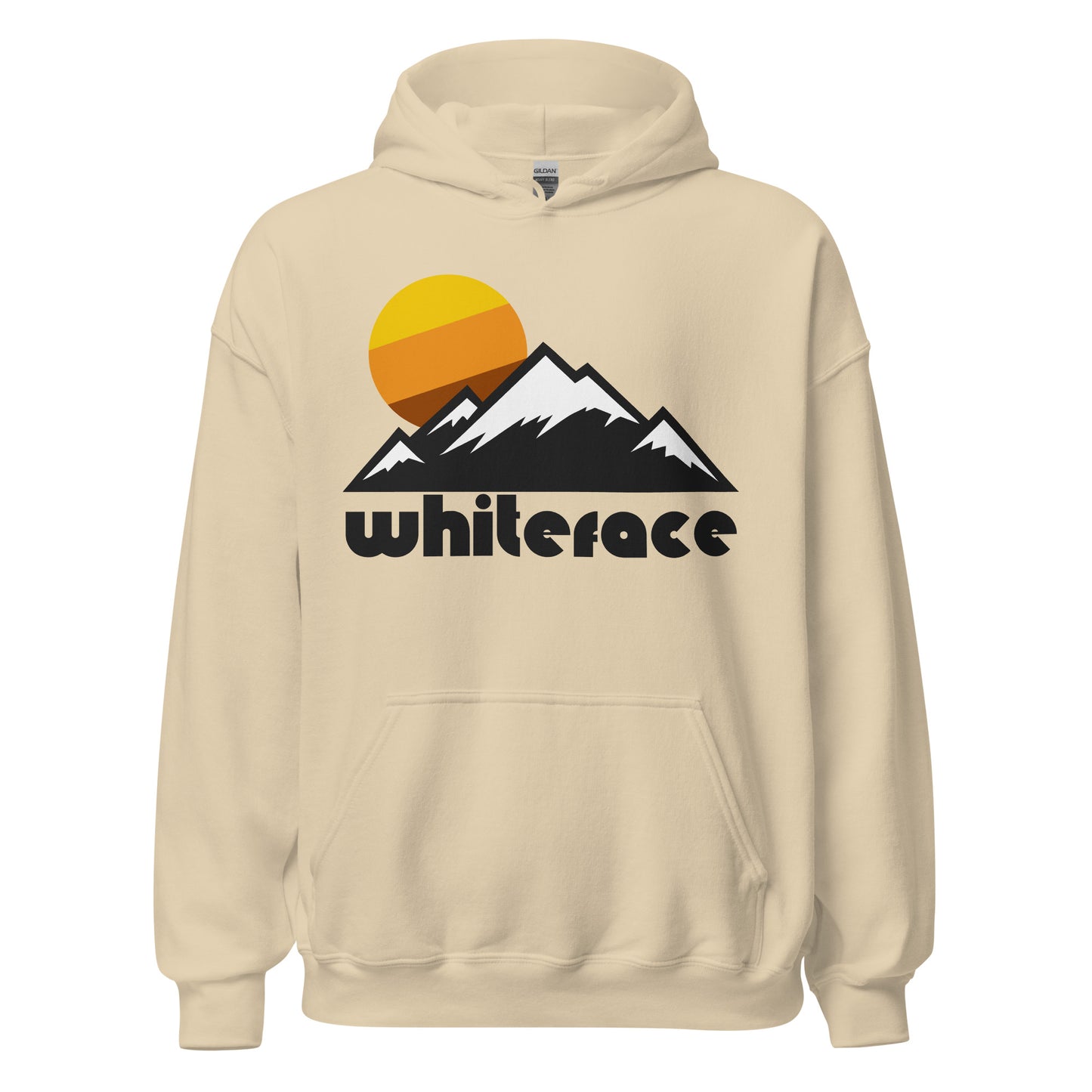 A sand colored Whiteface Mountain tourist and travel hooded sweatshirt that has the image of multiple snowy mountains and a yellow, brown, and orange sun setting. It's known for its skiing, is home to the New York Ski Resort, and is part of the Adirondack Mountain Range.