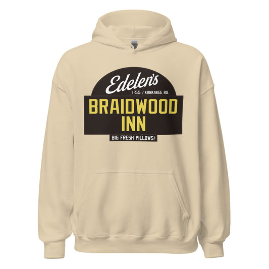 A sand colored retro Edelen's Braidwood Inn hooded sweatshirt that says "I-55 / Kankakee Rd." in Illinois and "Big Fresh Pillows!" References the 1980s John Hughes directed comedy movie 'Planes, Trains, & Automobiles', starring Steve Martin and John Candy. Now known as Sun Motel.