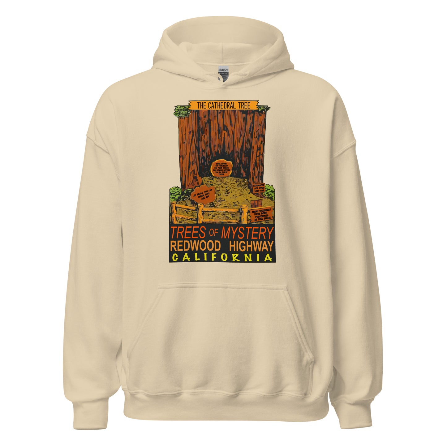 A 70s style vintage sad colored hooded sweatshirt with an image of "The Cathedral Tree", a hollow redwood behind a wooden fence. There are multiple historical signs which read "Many Weddings Have Been Performed At This Site", "Estimated Age Over 500 Years", "Sink Down, Oh Traveler, On Your Knees, God Stand Before You In These Trees", and "So Shall They Live When Ends Our Day". The sweatshirt says "Trees of Mystery", "Redwood Highway", and "California", the location.