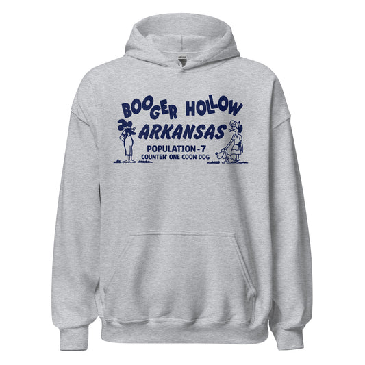 A retro tourist heavy blend sport grey colored hooded sweatshirt that says "Booger Hollow Arkansas" with a man and a pipe and a woman with a pipe and dog. Also says "Population - 7 Counten' One Coon Dog." Refers to the haunted town off Scenic 7 Byway.