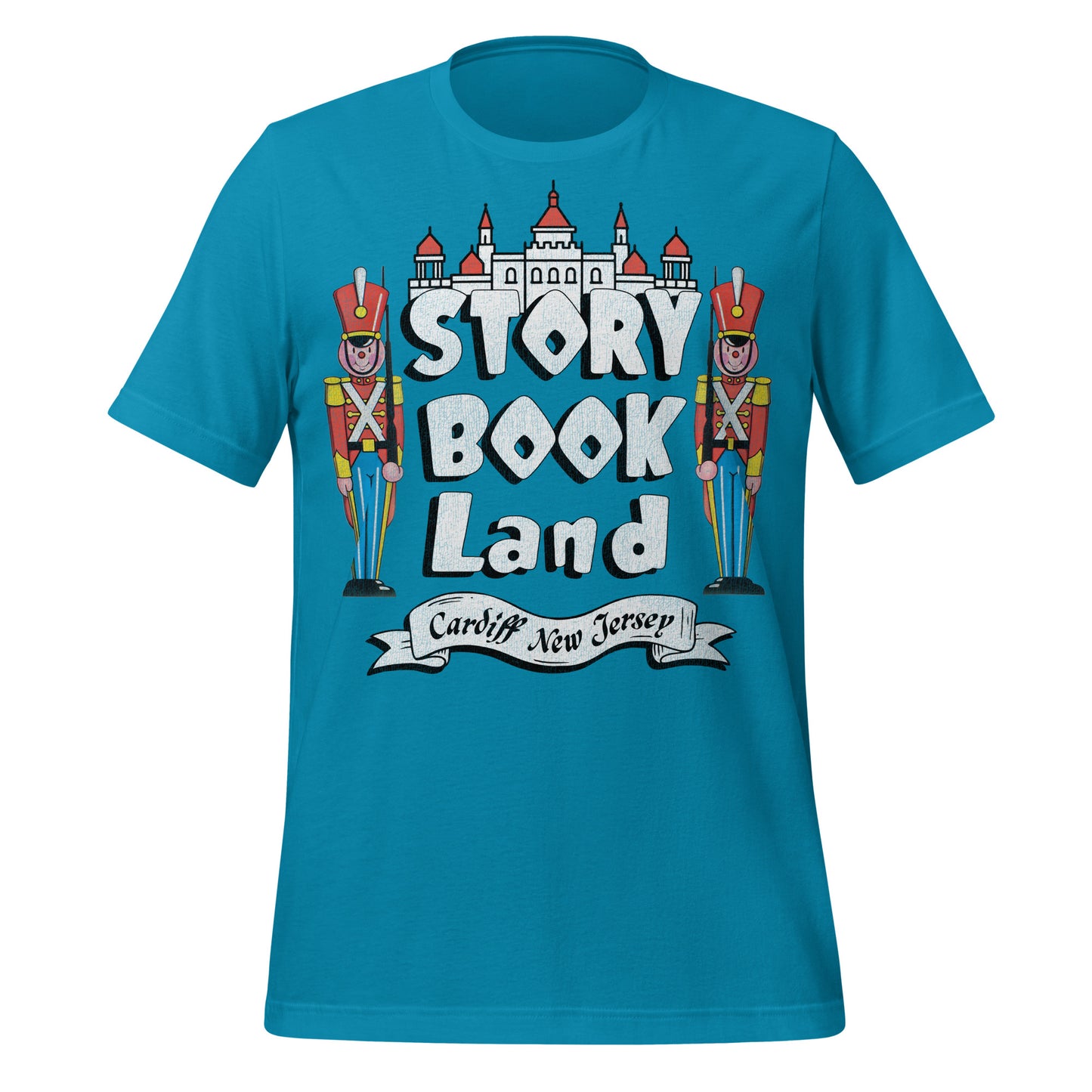 A blue short sleeve shirt from Story Book Land amusement park from Cardiff New Jersey. Has image of two toy soldiers standing under a castle palace.