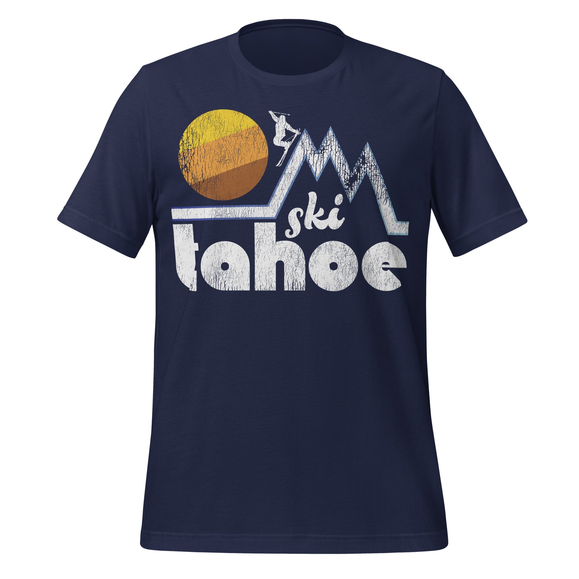 A navy blue retro Ski Tahoe t-shirt with the image of a person skiing down one of three steep, triangular mountain slopes as the sun sets. References the Lake Tahoe region of the Sierra Nevadas, on the border of California and Nevada, known for its many ski resorts such as Palisades Tahoe and Heavenly Ski Resort.