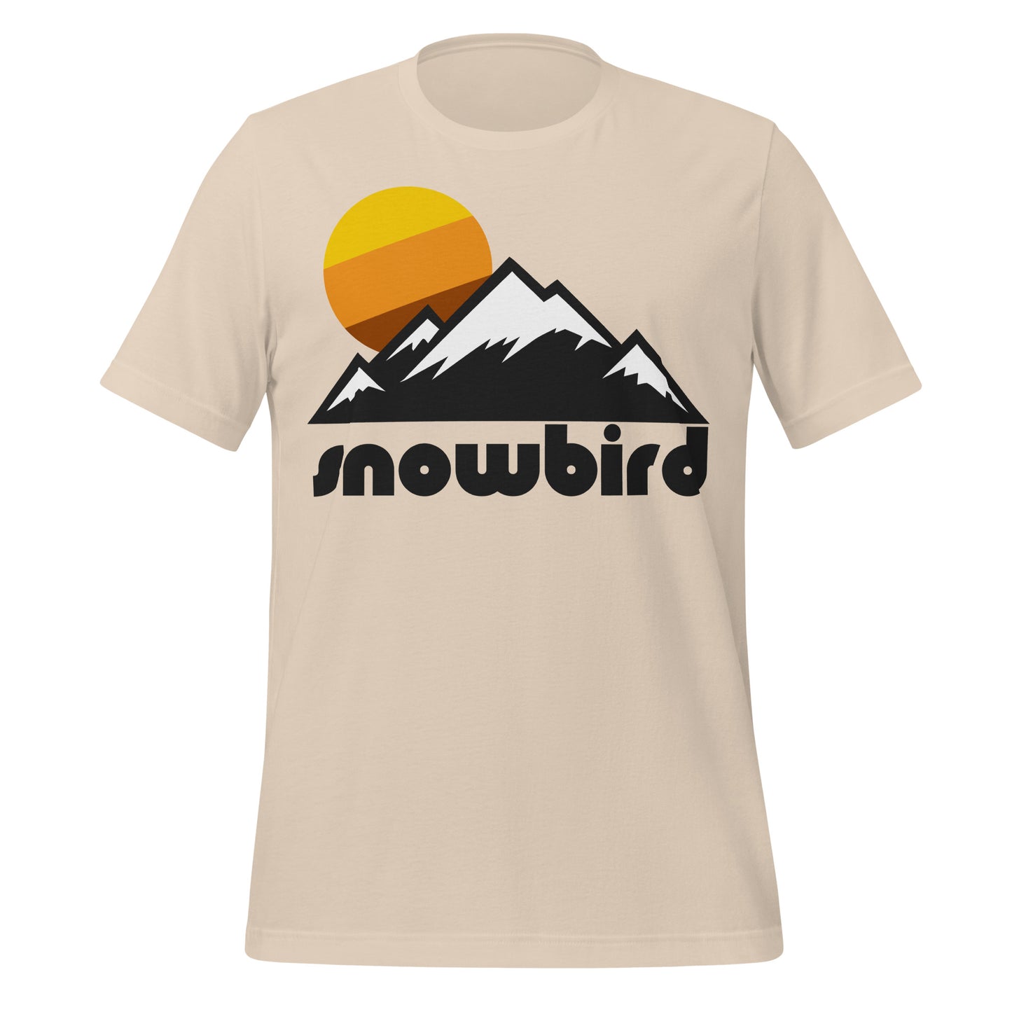 A soft cream colored short sleeve retro t-shirt that says "Snowbird" under the image of a mountain landscape, the peaks topped with snow, and a sun behind the peaks with yellow, orange, and brown colors. References the ski resort near Salt Lake City with difficult ski runs, located in Little Cottonwood Canyon.