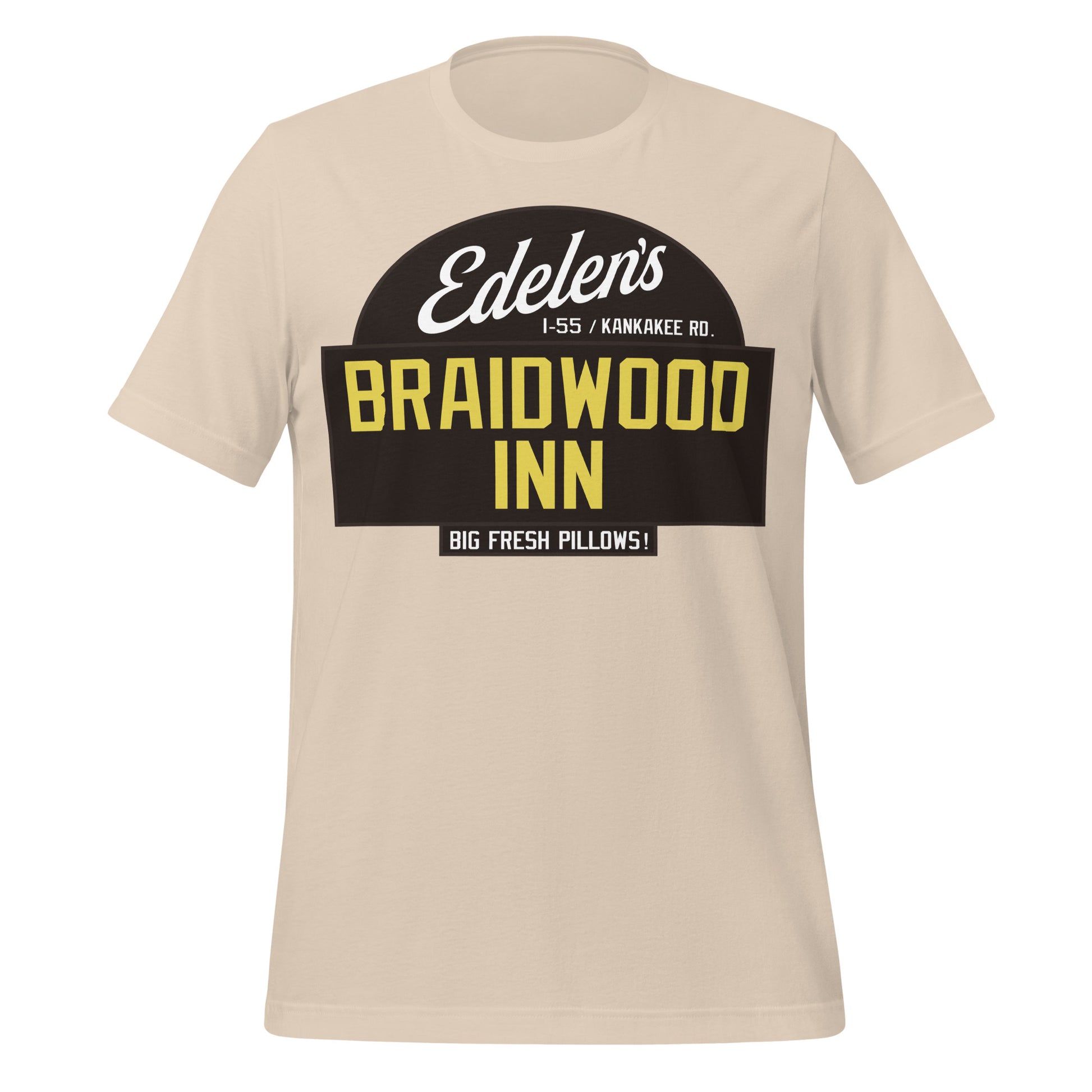 A soft cream colored 70s style Edelen's Braidwood Inn t-shirt, referencing the Braidwood III motel famous from the movie 'Planes, Trains & Automobiles", visited by characters Neal (played by Steve Martin) and Del (played by John Candy). Shirt also says the location, "I-55 / Kankakee Rd." and an advertisement: "Big Fresh Pillows!"